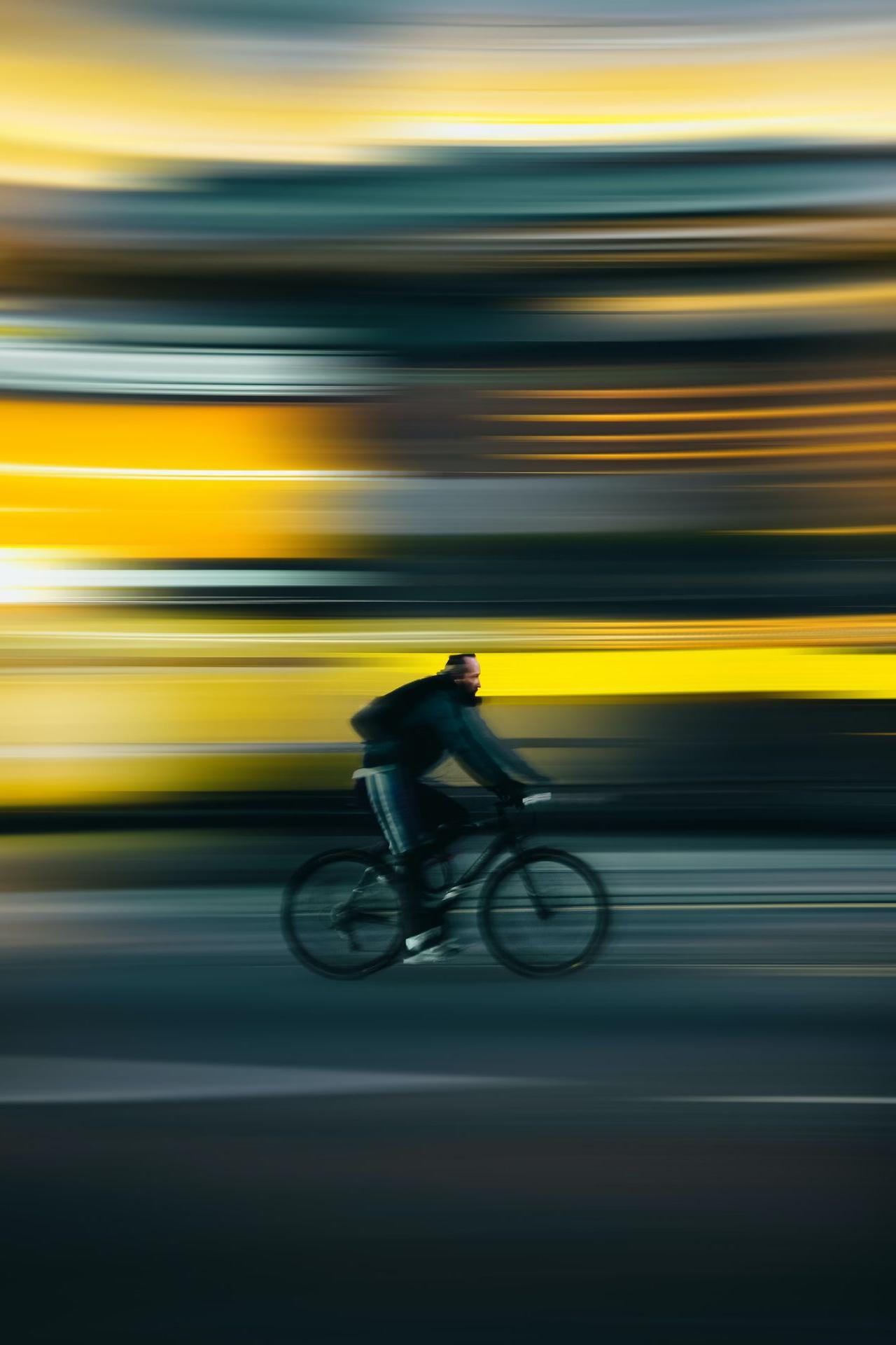 man riding bicycle on road during daytime